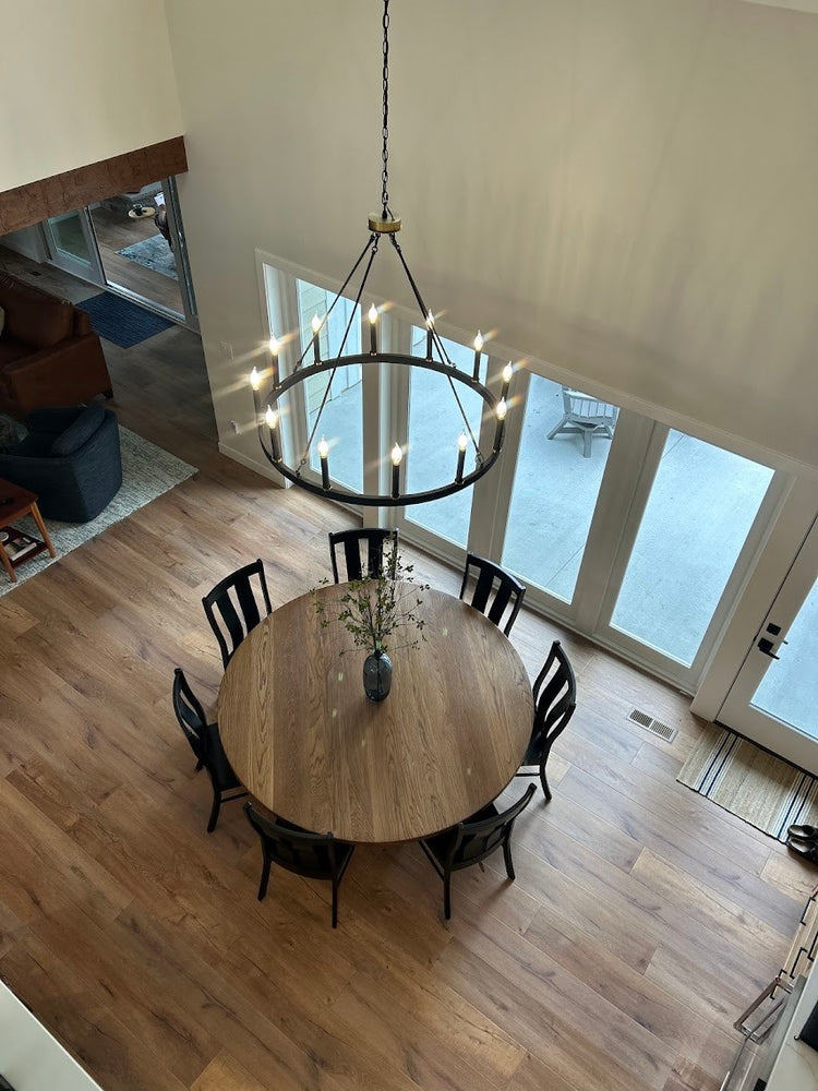 top view of  a large white oak dining table in a modern and contemporary home.