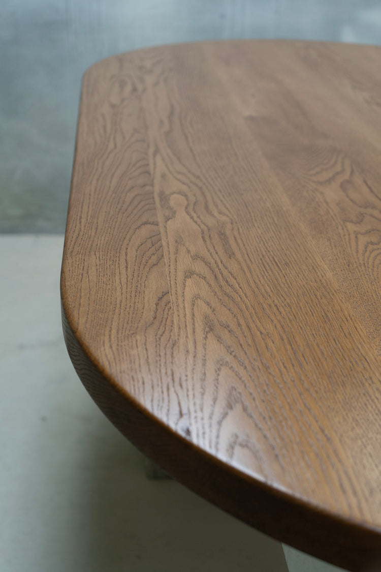 Close-up of a wooden table with a green background (paint booth)