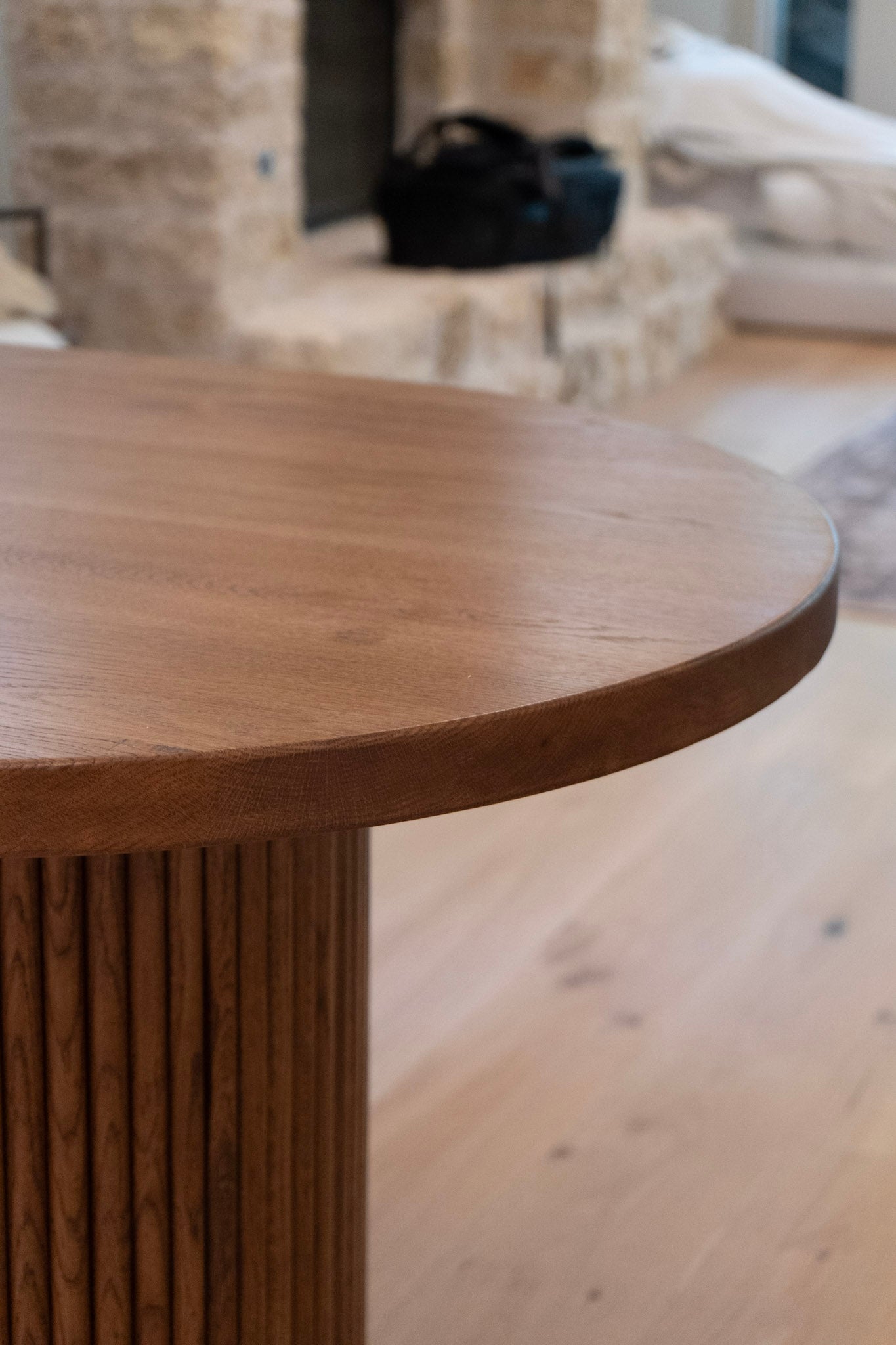 Wooden white oak table in a room with a blurred background