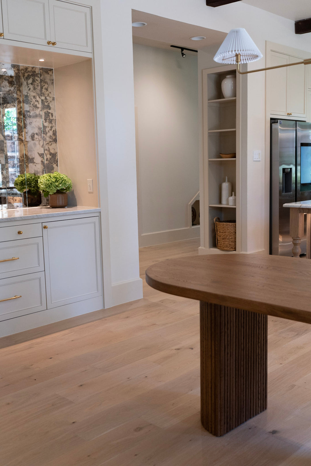 Modern kitchen with wooden island and white cabinets