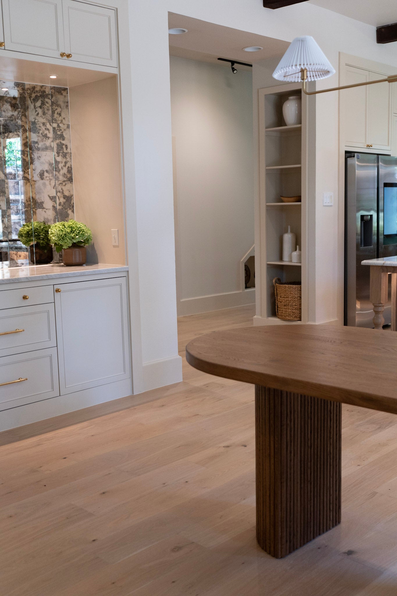 Modern kitchen with wooden island and white cabinets