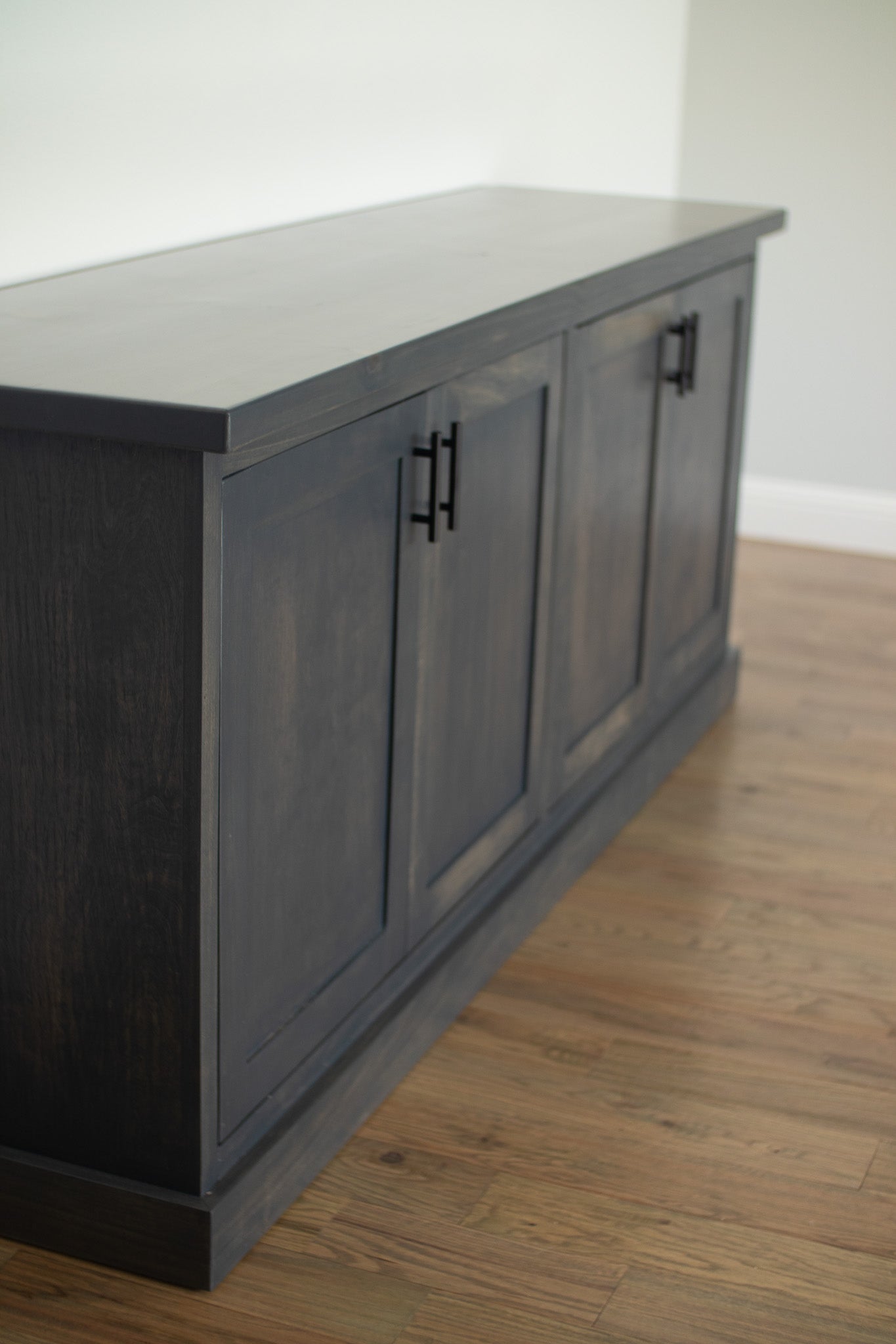 This spacious gray credenza features a modern and minimalist design.