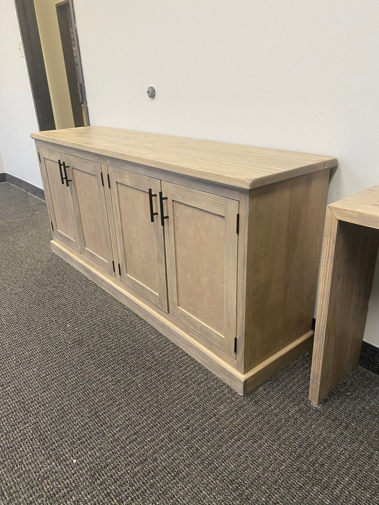 A large light brown credenza that blends modern and farmhouse styles. It's perfect for organization and adds a touch of convenience to your space.