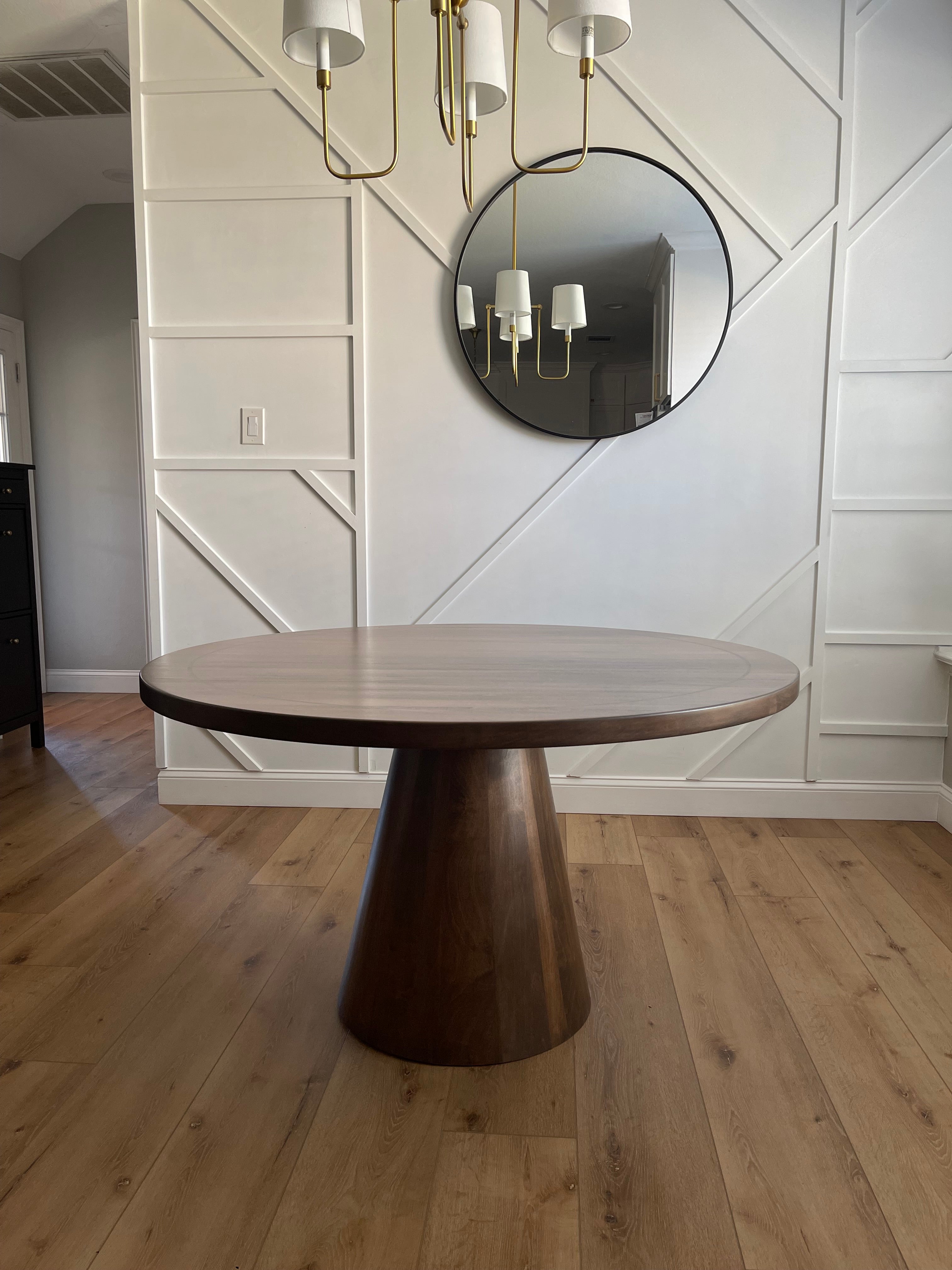 Handcrafted cone round dining table with solid wood construction, featuring a tapered base angled at 10 degrees for a modern, unique design