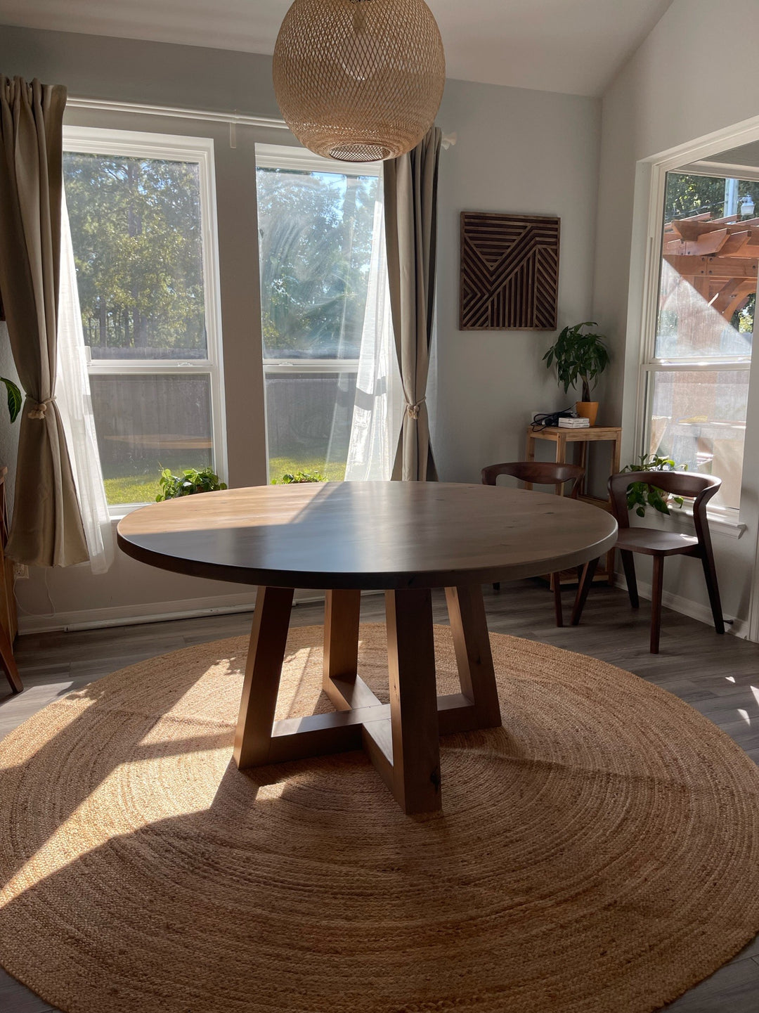 60" trapezoid round dining table - knotty alder in teakwood stain