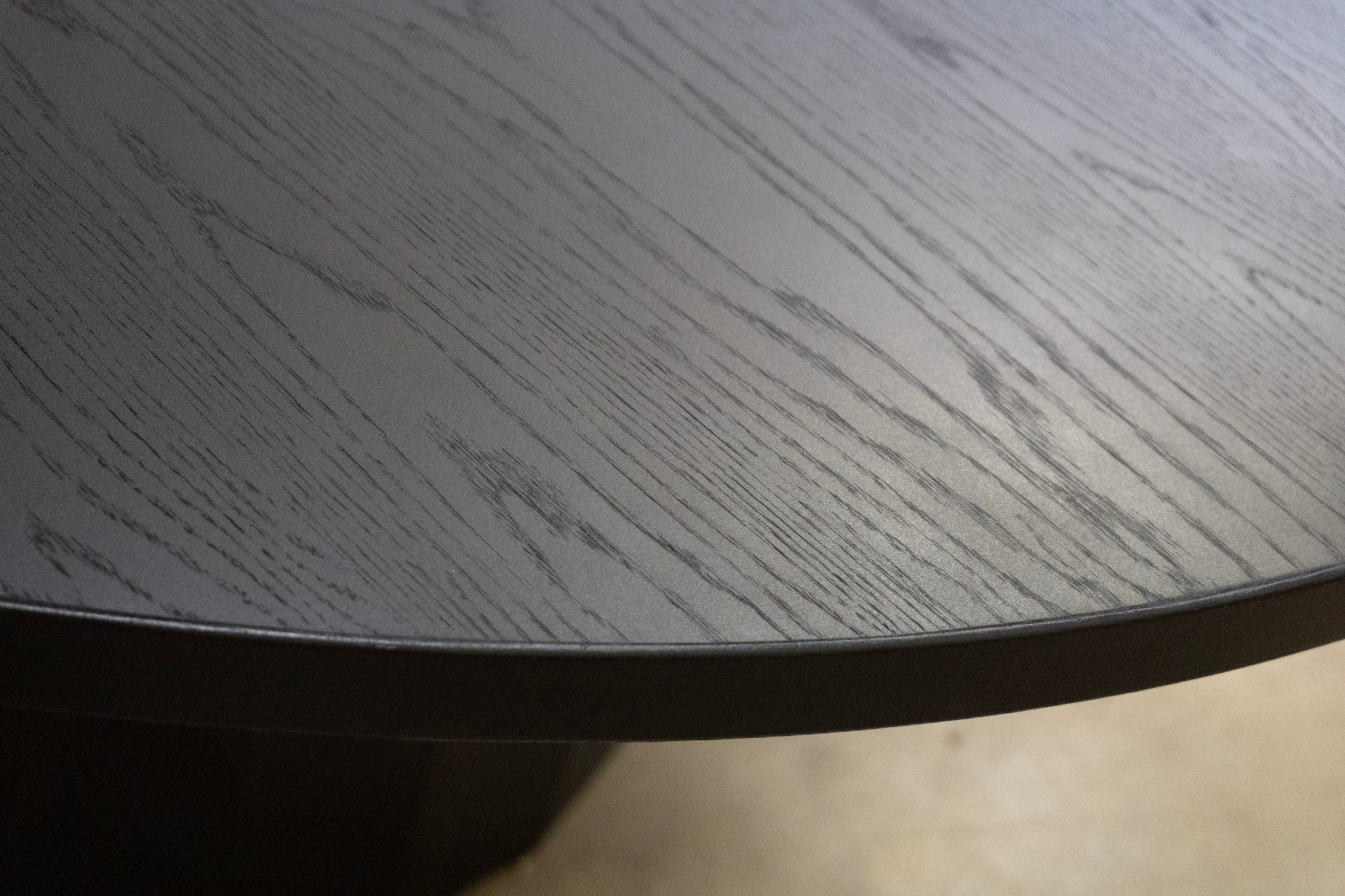 Close-up of a round table with a textured surface
